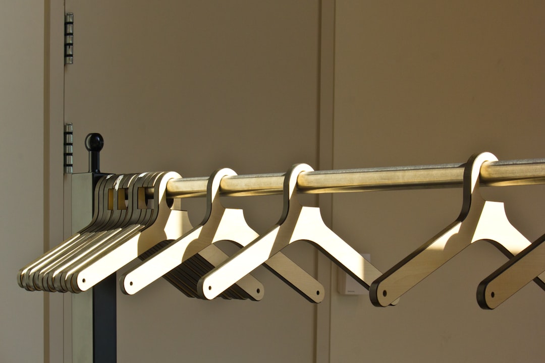 A row of wooden hangers is hanging.
