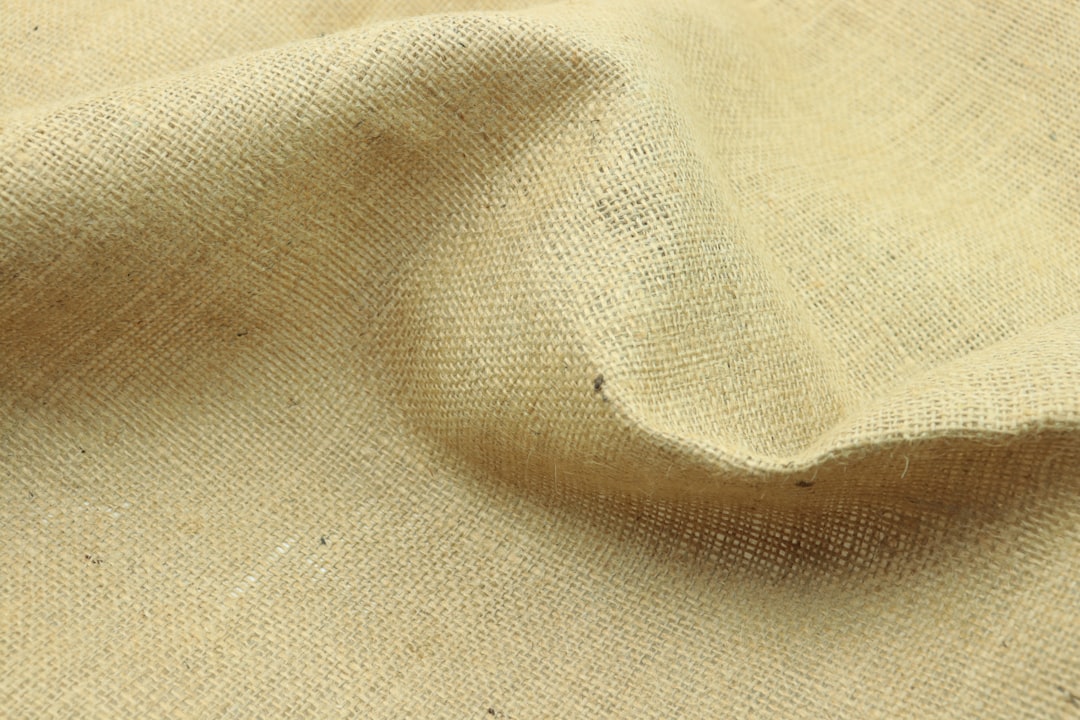 a close up view of a beige fabric