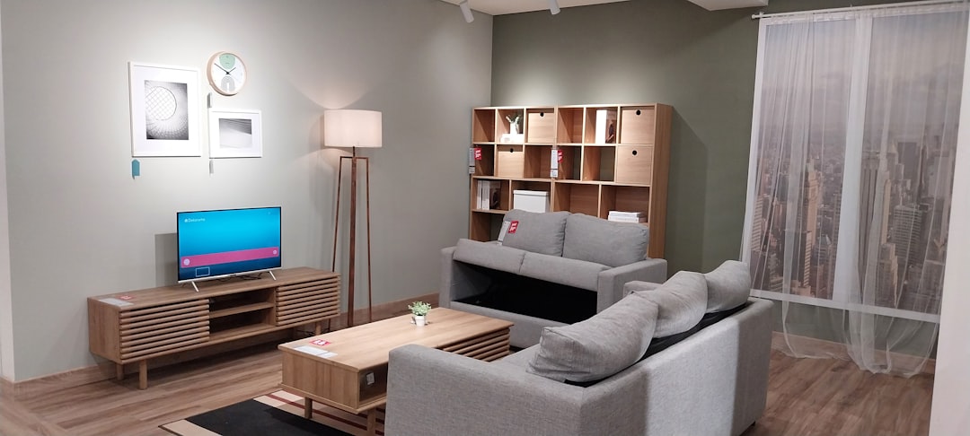a living room filled with furniture and a flat screen tv